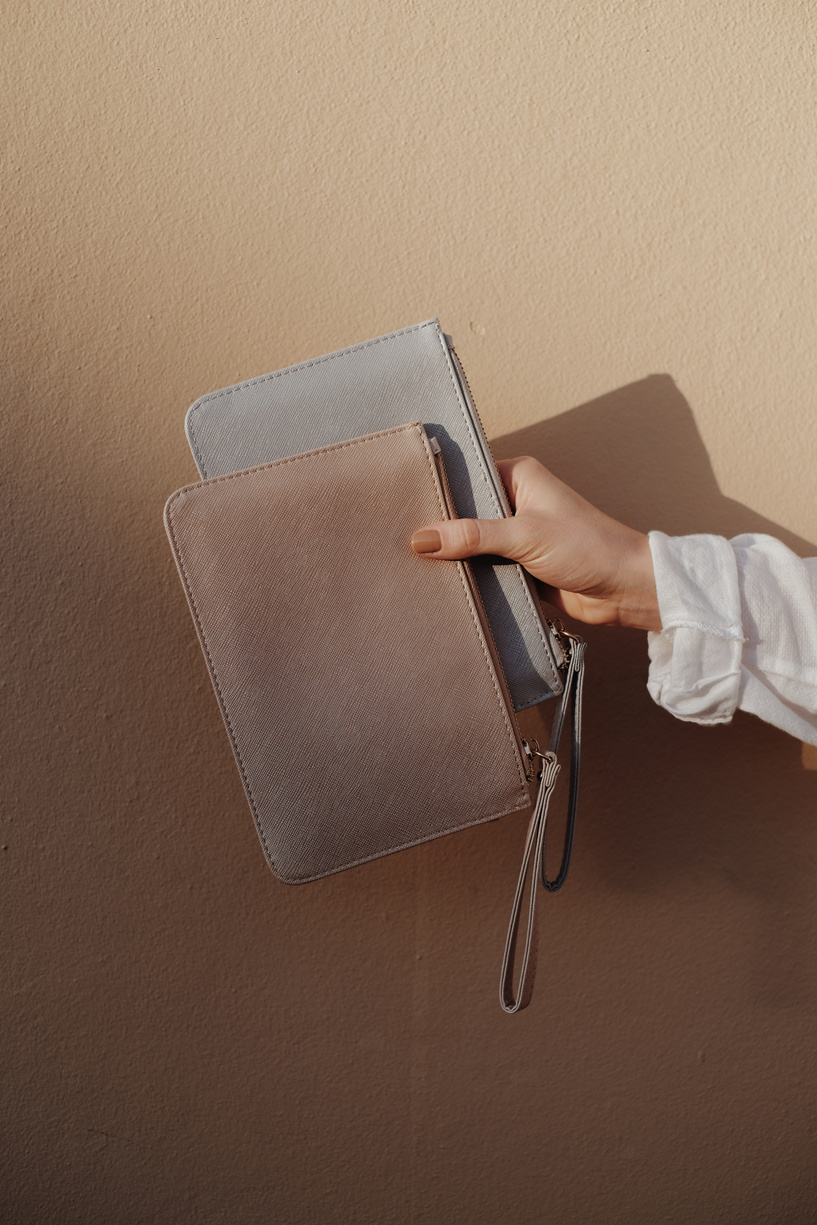 Woman holding wristlets in different colors